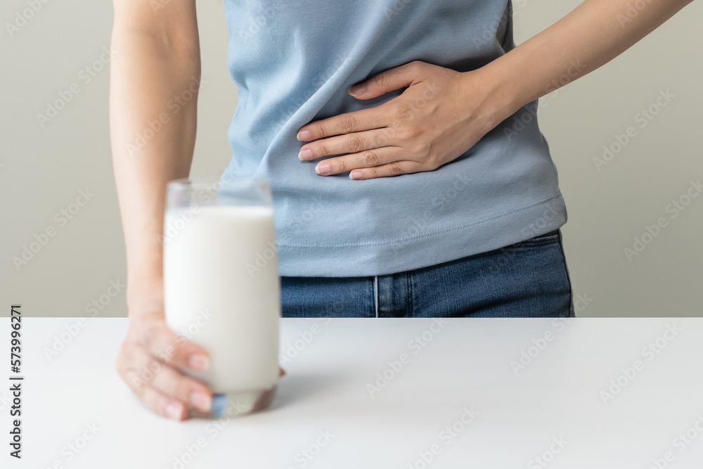 Pain, suffering asian young woman having a stomachache, abdominal pain