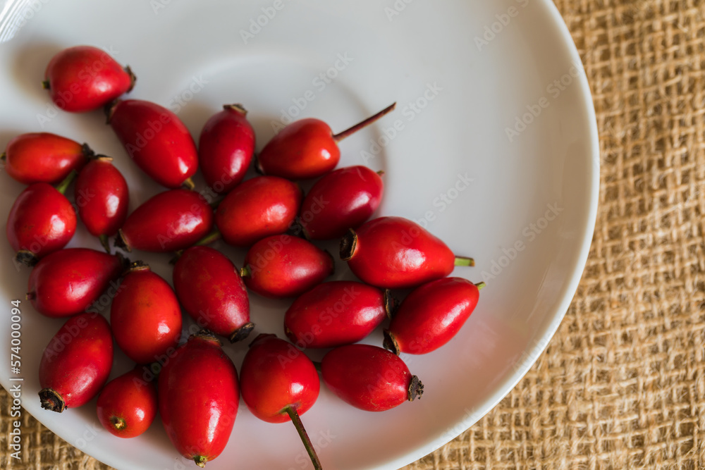 Ripe rose hips harvested for making preserves for the winter, close-up. Healthy eating. Ripe rose hips harvested for making preserves for the winter, close-up. Healthy eating.
