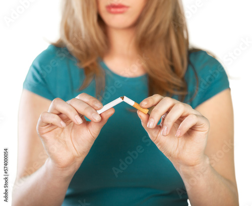 A woman breaking a cigarette, Stop smoking concept