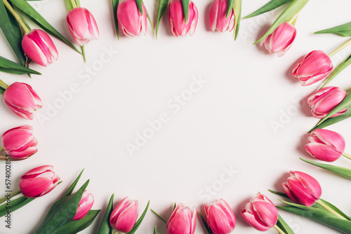 Wallpaper Mural Beautiful fresh pink tulips in full bloom on white background, top view. Negative space for text. Minimalist flat lay with spring flowers. Torontodigital.ca