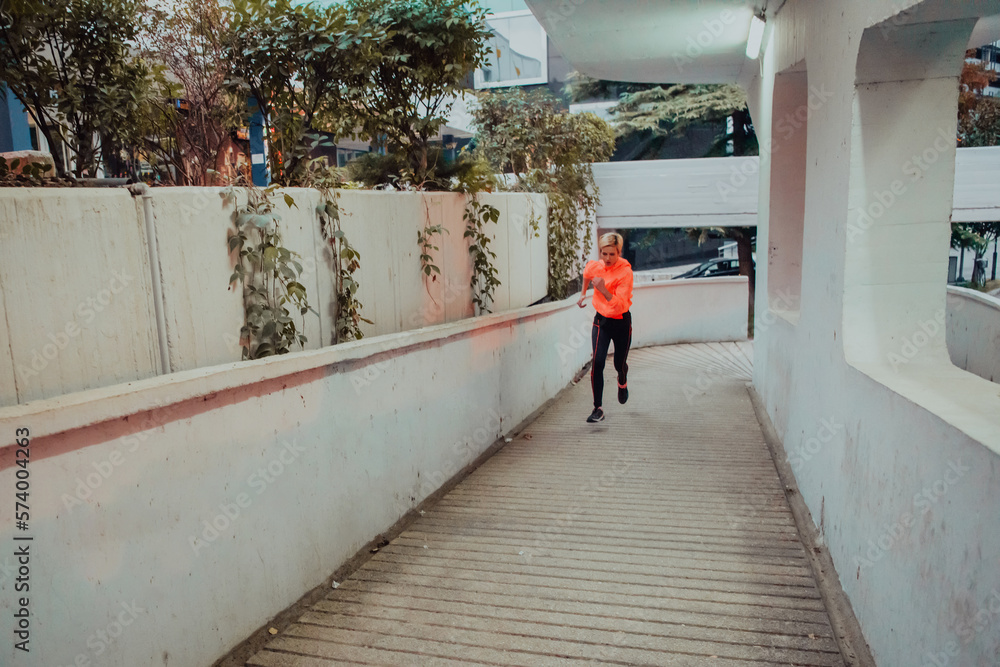 custom made wallpaper toronto digitalWomen in sports clothes running in a modern urban environment et night time. The concept of a sporty and healthy lifestyle