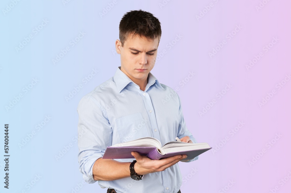 Smart young man student reading book Smart young man student reading book