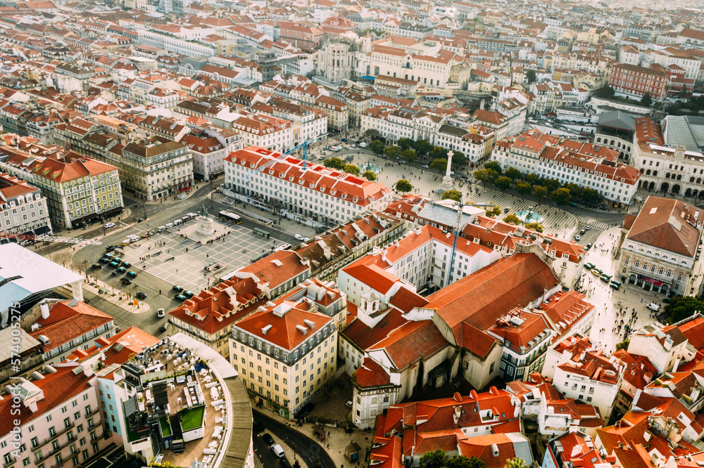 Aerial drone view of major squares and landmarks in Lisbon's Baixa District, including Figuera and Rossio Squares
