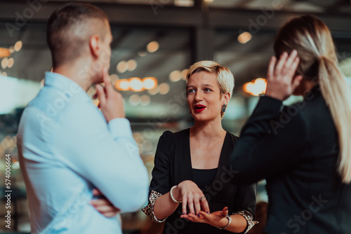 Photography Photo of a business team of young people discussing business ideas in a modern urban environment