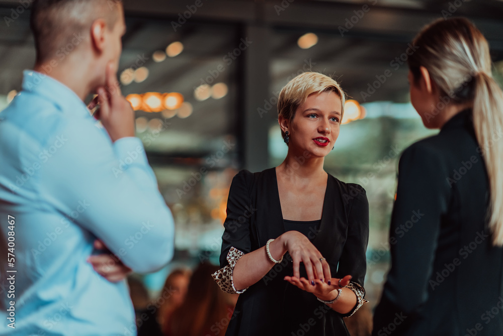 Photo of a business team of young people discussing business ideas in a modern urban environment. Selective focus Photo of a business team of young people discussing business ideas in a modern urban environment. Selective focus