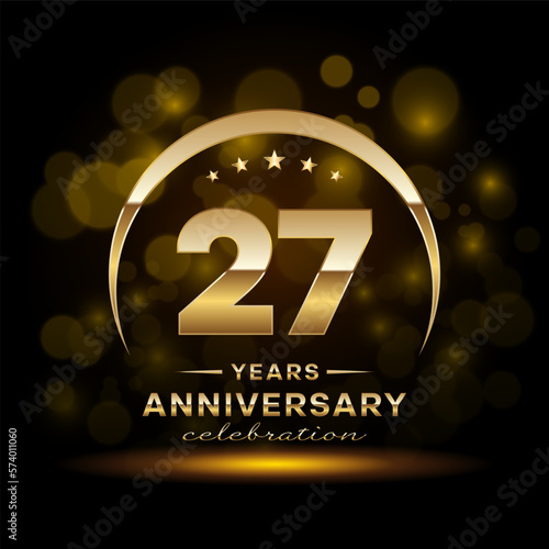 27th Anniversary Celebration. Anniversary logo design with golden ring concept. Logo Vector Template Illustration photo