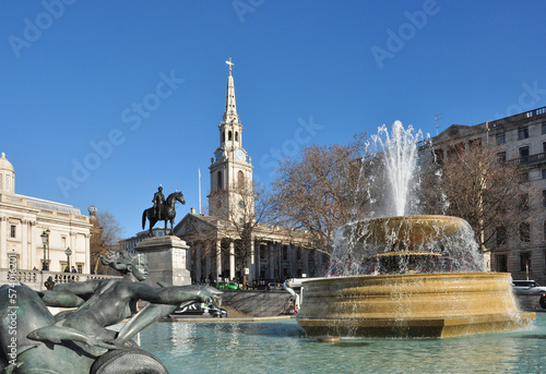 Fountain with water spray, St Martin-in-the-Fields Church and Equine Statue, Trafalgar Square, London
