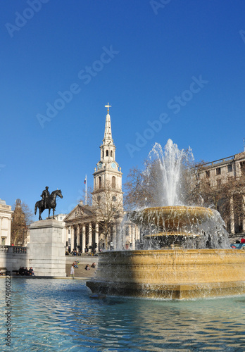Fountain with water spray, St Martin-in-the-Fields Church and Equine Statue, Trafalgar Square, London