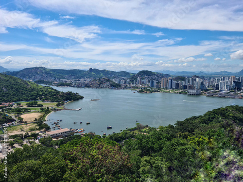 Image from the highest point of a hill in a Brazilian city surrounded by hills and beaches.