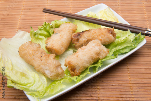 spring rolls or Vietnamese rolls with endive and oriental chopsticks