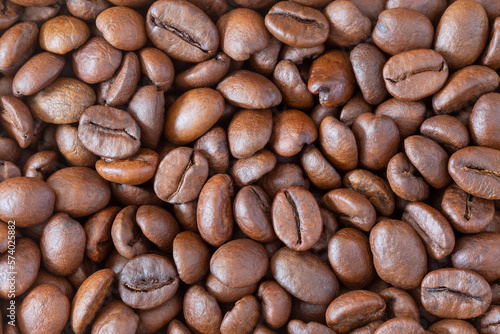 Roasted coffee beans background  top view macro  Coffea.