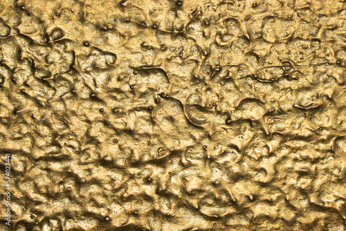 Gold background. Golden decorative pattern. Metal texture. Closeup macro artistic design.