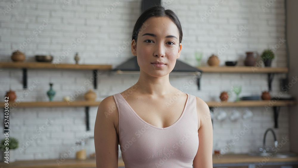 Portrait of young beautiful Asian woman looking at the camera and smiling Portrait of young beautiful Asian woman looking at the camera and smiling