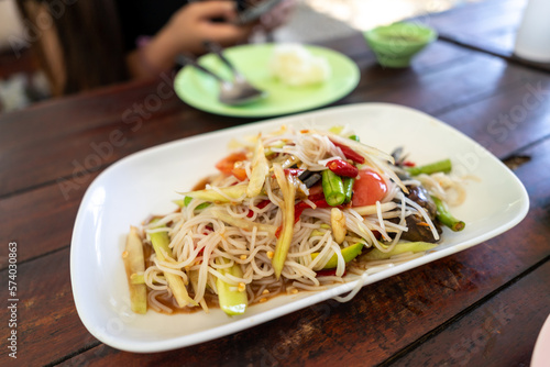Tam Sua is another form of papaya salad of Isaan people. It is a food born from the wisdom of combining seasonings, fresh vegetables that are available in the fields and fields. into a delicious dish
