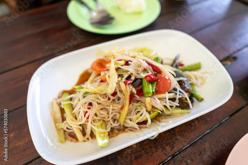 Tam Sua is another form of papaya salad of Isaan people. It is a food born from the wisdom of combining seasonings, fresh vegetables that are available in the fields and fields. into a delicious dish
