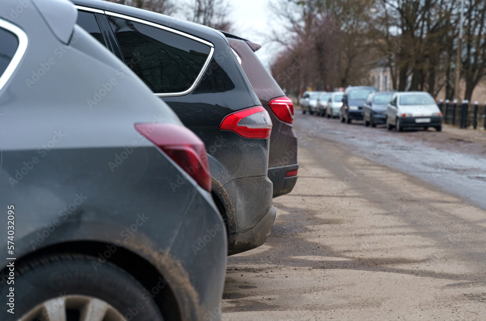 Cars are parked in the autumn or spring season in the city