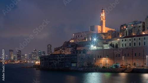 Tel Aviv-Yafo, Israel - July 06, 2020: Night Jaffa and Tel Aviv skyline. Ancient city and port