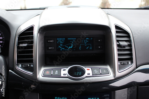 Modern car climate control panel for driver and passenger. Zone climate control. Car interior detail.