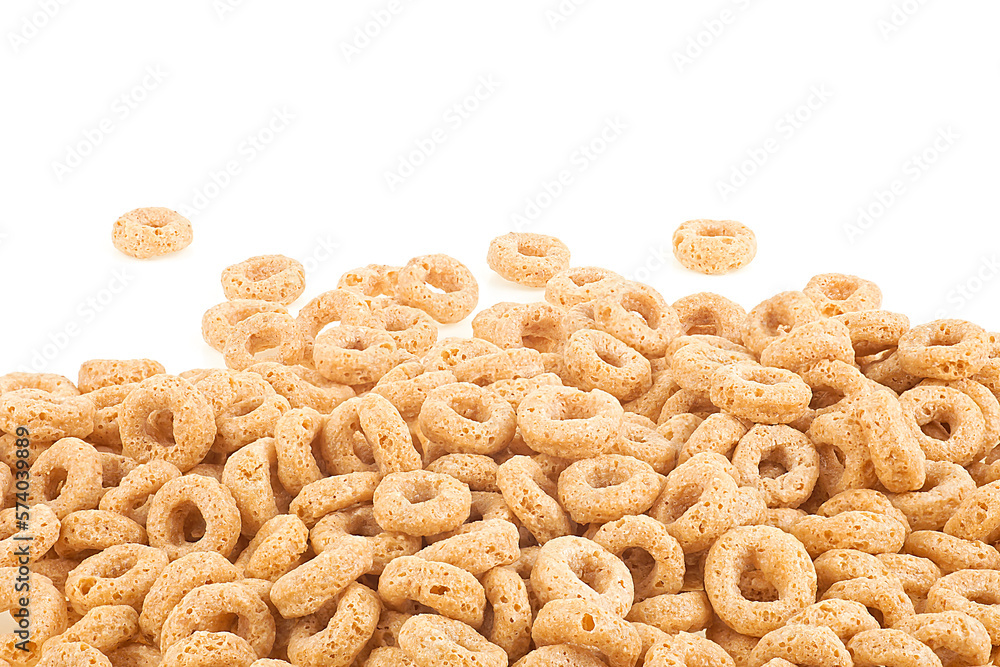 Breakfast cereal sweet rings isolated on a white background, front view. Pile of oat cereal. Breakfast cereal sweet rings isolated on a white background, front view. Pile of oat cereal.