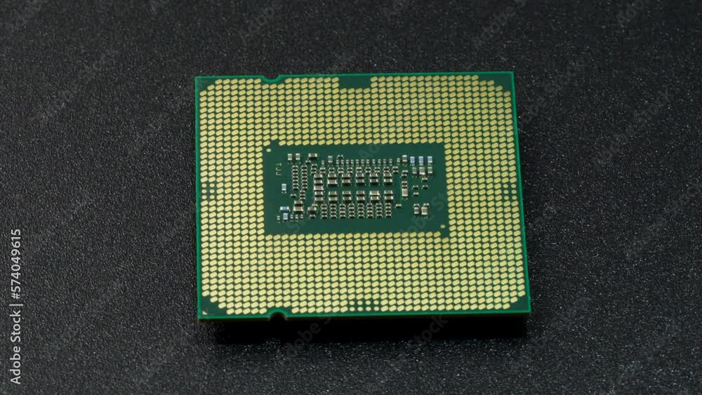 Computer CPU chip rotating - close up video. Shallow field of view. Macro shot of technology background. Computer CPU chip rotating - close up video. Shallow field of view. Macro shot of technology background.