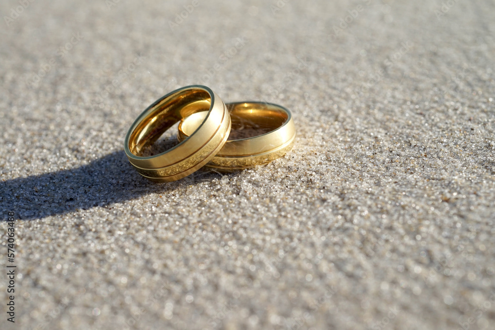 Wedding rings at the beach with copy space Wedding rings at the beach with copy space