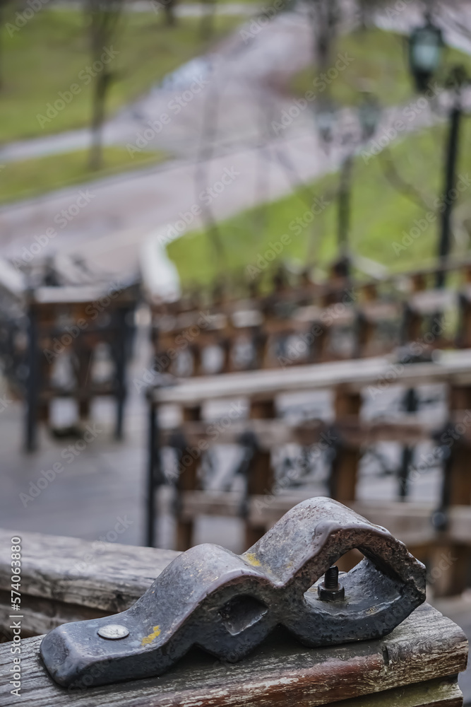 Decorative element on the old staircase made of steel and wood in the park of the city of Chernihiv, an old staircase in the park area Decorative element on the old staircase made of steel and wood in the park of the city of Chernihiv, an old staircase in the park area