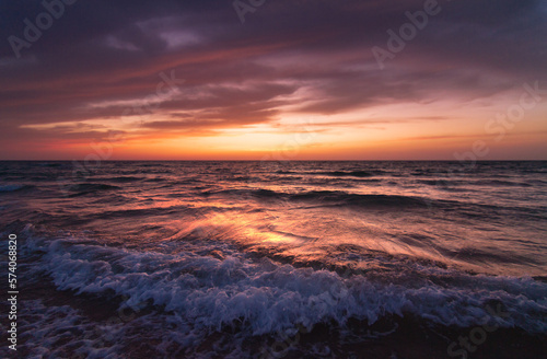 Sunset over the sea shore  sandy beach  colorful sky