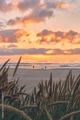 people enjoying sunset at the coast in denmark. High quality photo