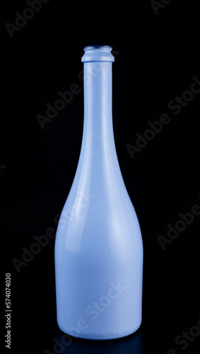 Wallpaper Mural Blue bottle of sparkling wine isolated on black background. Bottle for layouts of presentation projects. Torontodigital.ca