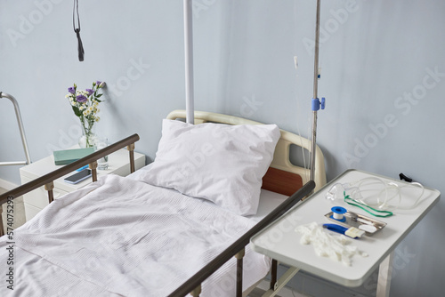 Background image of bed in hospital room interior, copy space © Seventyfour