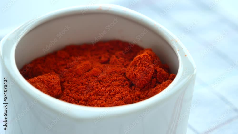 Chili powder and red peppers on table background. Chili powder and red peppers on table background.