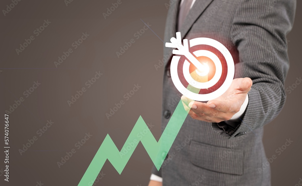 Business man with target sign on virtual screen Business man with target sign on virtual screen