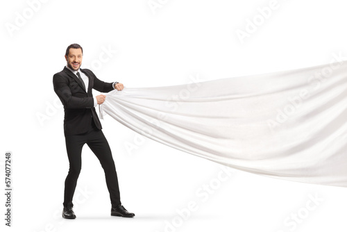 Businessman pulling a white piece of cloth