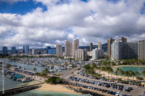 Aerial view of Ala Wai Boat Harbor and Honolulu hotels and buildings. 