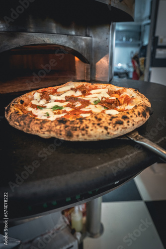 Pizza napoletana in preparation by pizzaiolo