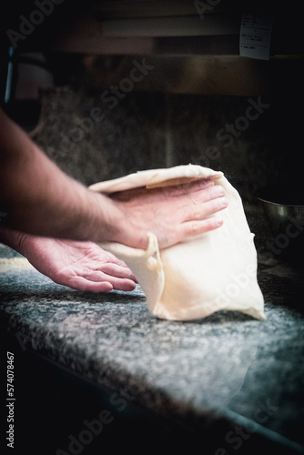 Pizza napoletana in preparation by pizzaiolo