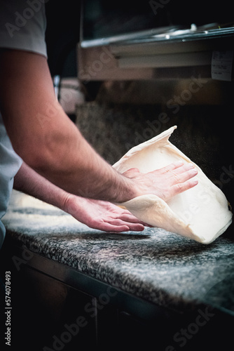 Pizza napoletana in preparation by pizzaiolo