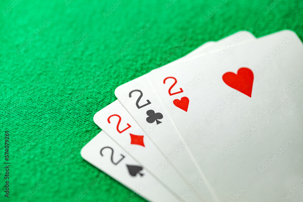 Playing cards, poker combination four of kind, quads, deuces of different suits, same value Playing cards, poker combination four of kind, quads, deuces of different suits, same value