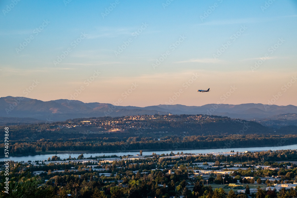 Plane Preparing to land in Portland PDX Airport with Washington Landscape Plane Preparing to land in Portland PDX Airport with Washington Landscape