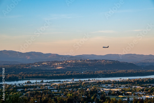 Plane Preparing to land in Portland PDX Airport with Washington Landscape photo