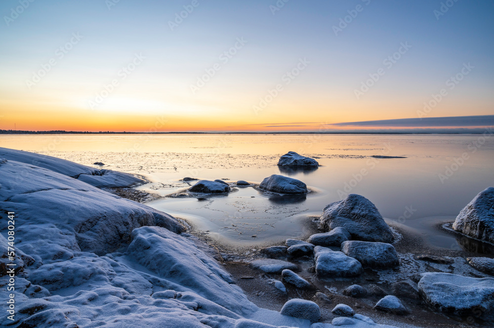 Sunset over the frozen sea and beach. Pörkenäs, Jakobstad/Pietarsaari, Finland Sunset over the frozen sea and beach. Pörkenäs, Jakobstad/Pietarsaari, Finland