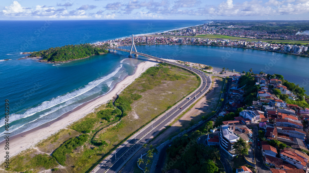 Naklejka premium Aerial view of Ilheus, tourist town in Bahia. Historic city center with famous bridge in the background.