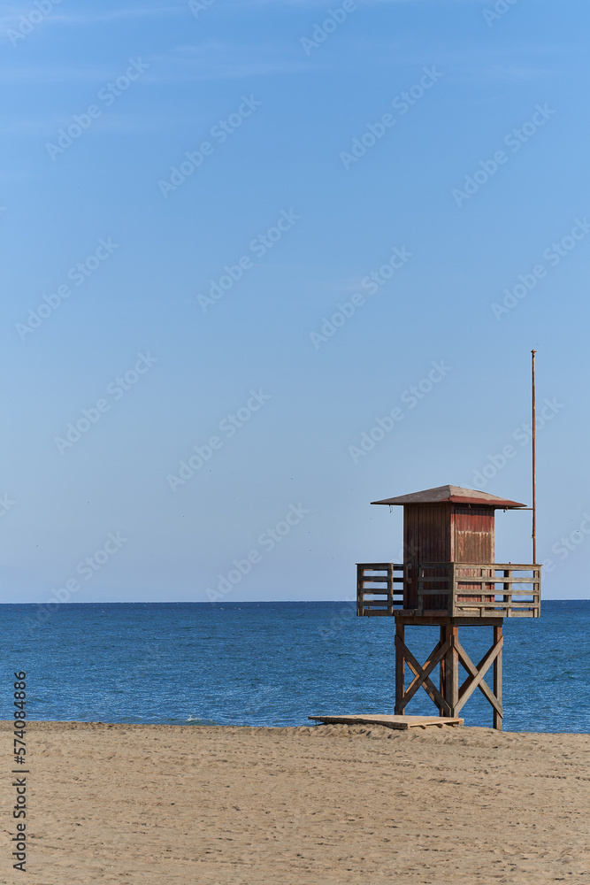 lifeguard booth on the beach with the sea in the background