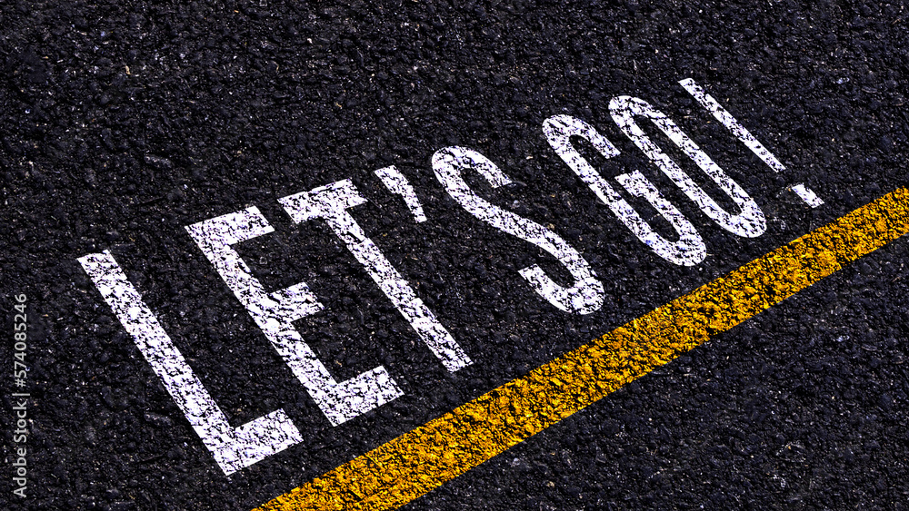 Obraz premium Word Go written on road in the middle of an empty asphalt road for business planning strategies and challenges or career path opportunities and change, road to success concept