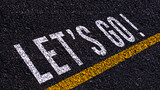 Word Go written on road in the middle of an empty asphalt road for business planning strategies and challenges or career path opportunities and change, road to success concept