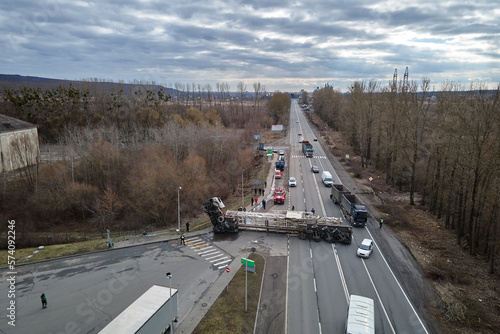 Fényképezés Aerial view of road accident with overturned truck blocking traffic