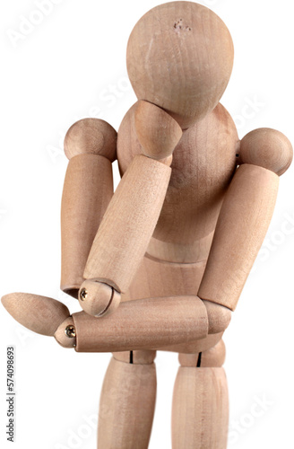 Miniature wooden mannequin in a thinking pose