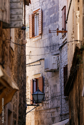 Picturesque narrow street with stone houses. Trogir, Dalmatia, Croatia, Europe © Casa.da.Photo