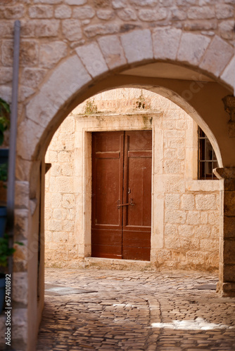 Picturesque narrow street with stone houses. Trogir  Dalmatia  Croatia  Europe