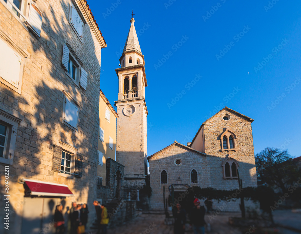 View of Budva old town streets, Budva Municipality and Riviera, resort on the Adriatic sea coast, Montenegro, sunny day with a blue sky, cathedral and citadel, travel to Montenegro